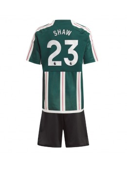 Otroški Nogometna dresi replika Manchester United Luke Shaw #23 Gostujoči 2023-24 Kratek rokav (+ hlače)